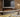 Panoramic electric fire with realistic flames and wood wall panelling