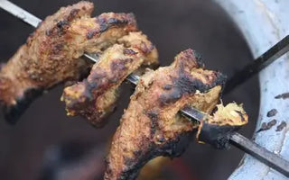 Tandoori chicken cooked on a home tandoor grill oven