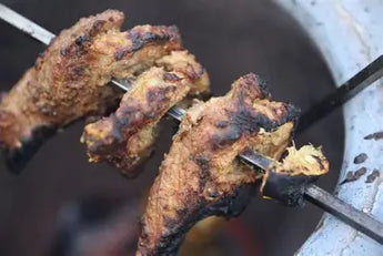 Tandoori chicken cooked on a home tandoor grill oven