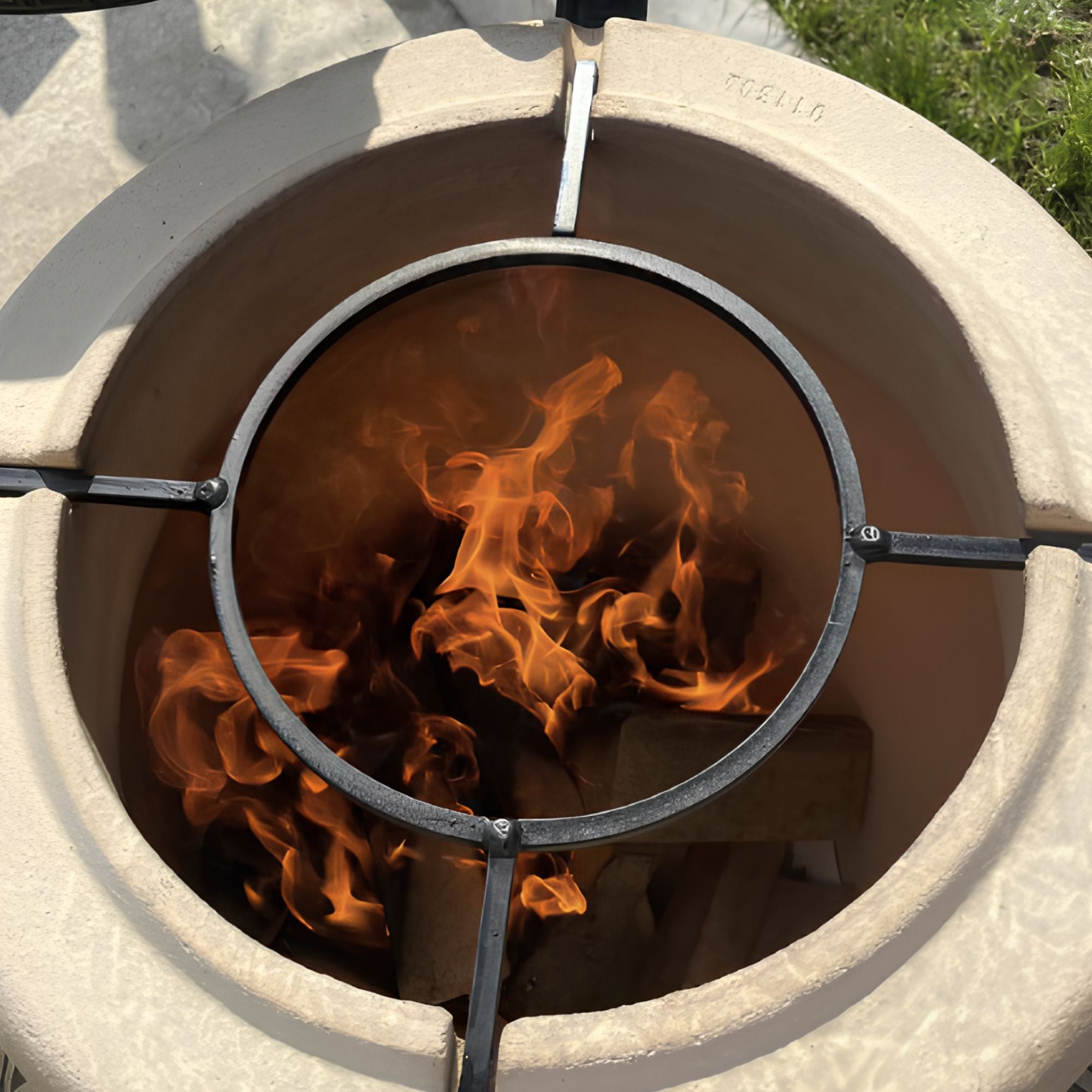 Large outdoor clay tandoor oven and grill with extra thick fire clay walls for maximum heat retention