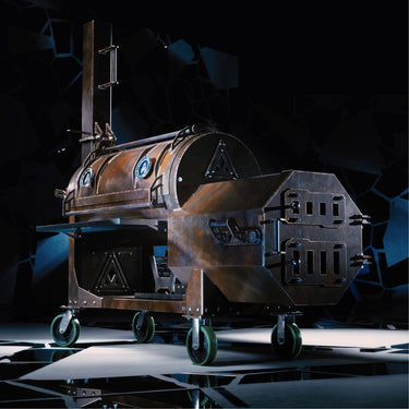 Side profile of the Fractal 90 heavy gauge steel smoker showing its industrial custom offset design
